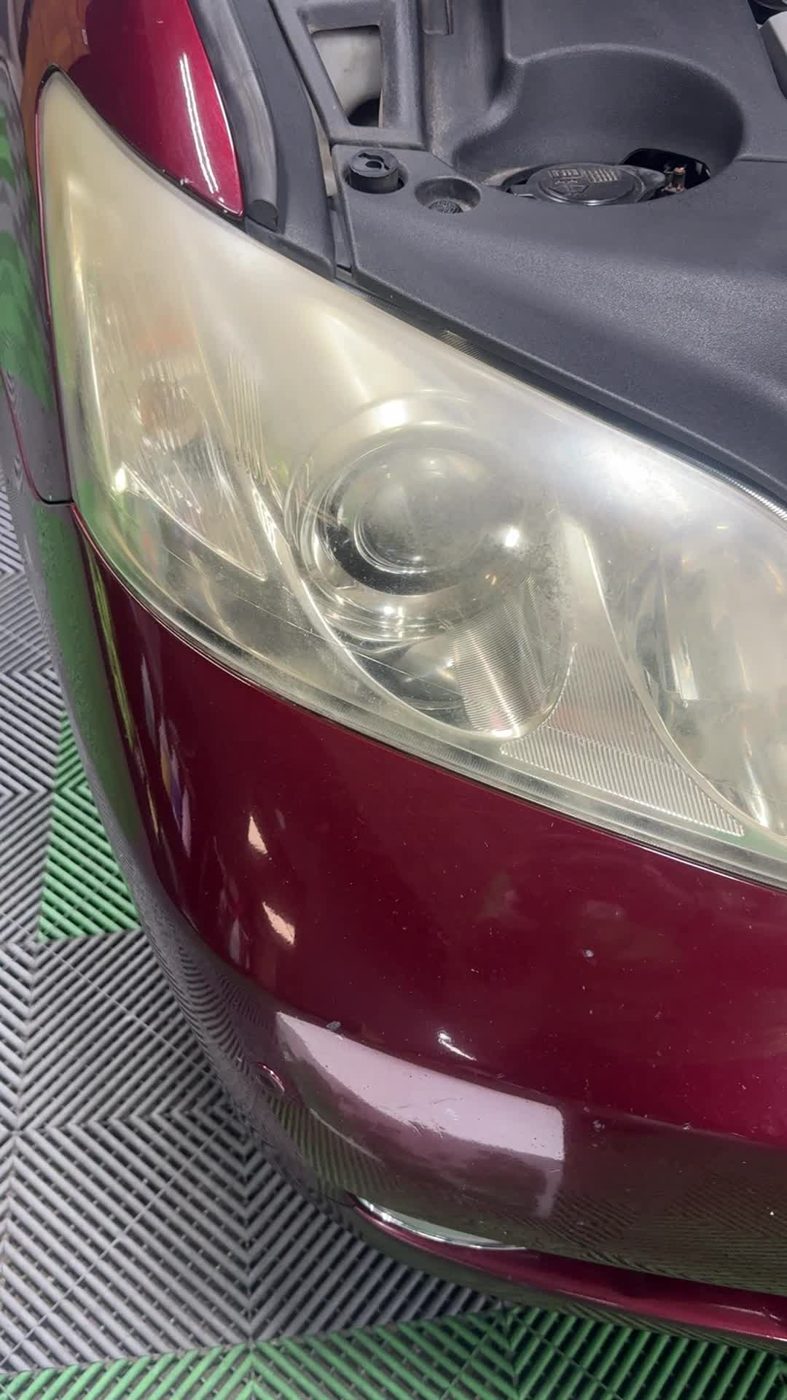 Foggy, yellowed headlight before headlight restoration McHenry IL service by Unicorn Details