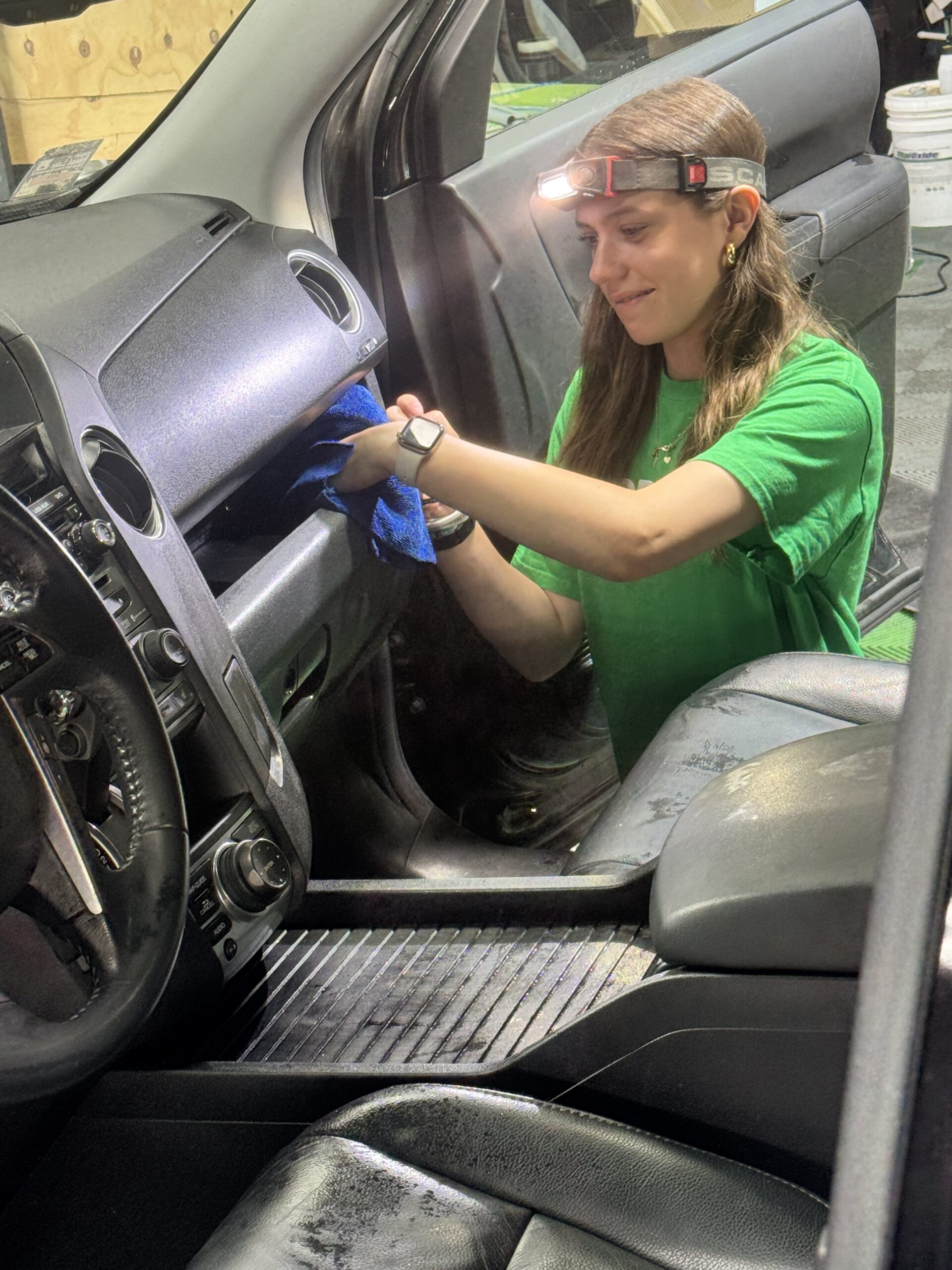 Harper detailing a vehicle interior at Unicorn Details McHenry