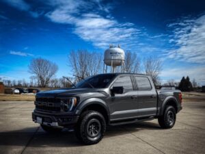 A truck parked in a parking lot.